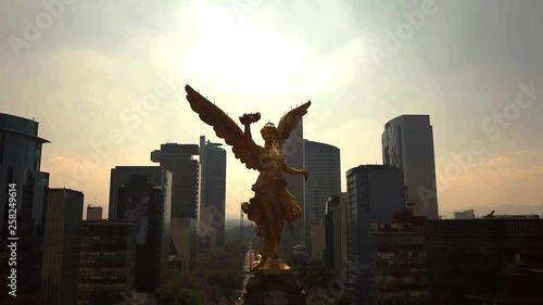 Flying in the Angel of Independece in Mexico City and going down on the statue. photo