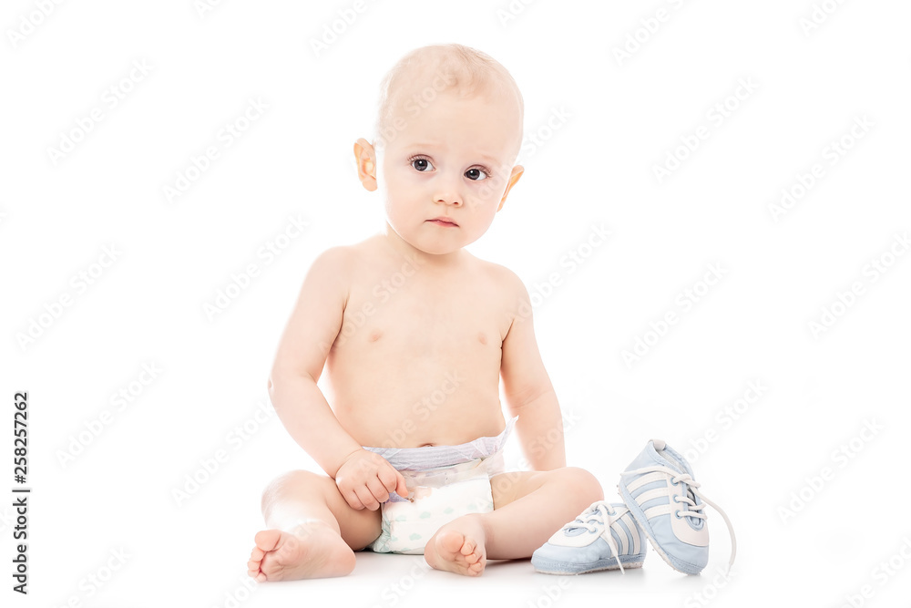 Happy child is sitting on floor, isolated over white. space for text. Happy child is sitting on floor, isolated over white. space for text.