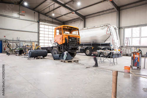 Paint shop and lighting in the large trucks and passenger cars are painted and also repaired