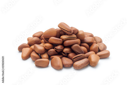 Pile of pine nuts isolated on white background