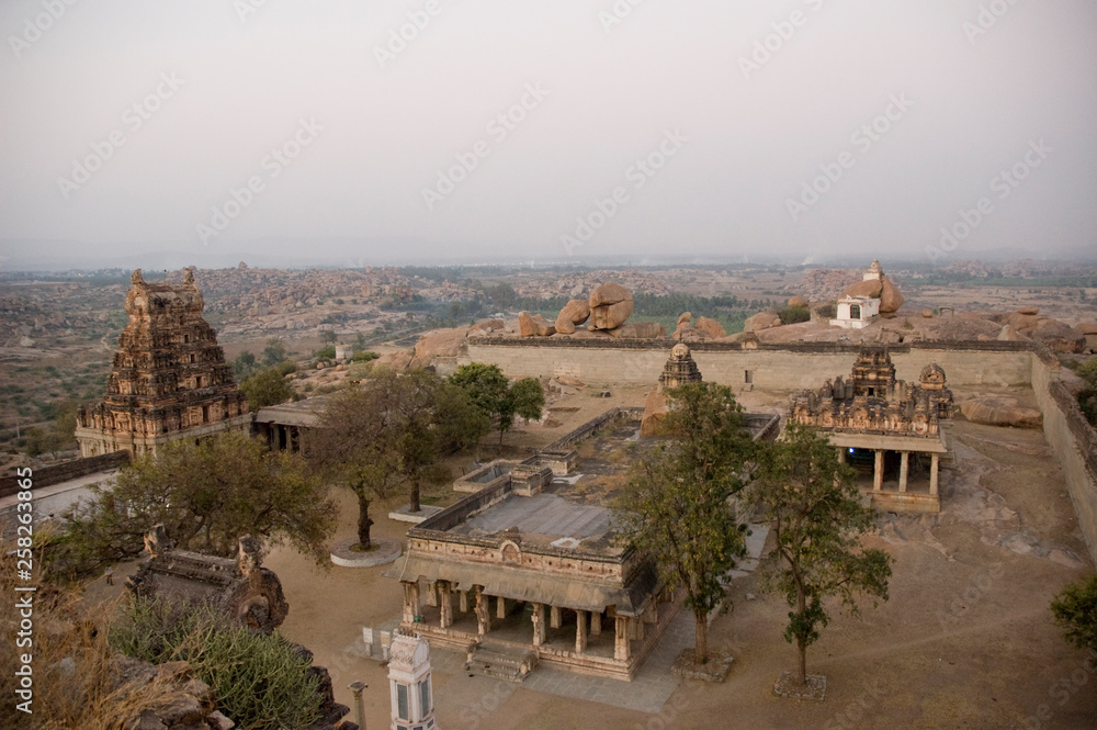 Fototapeta premium Virupaksha temple view from Hemakuta hill at sunrise in Hampi, Karnataka, India