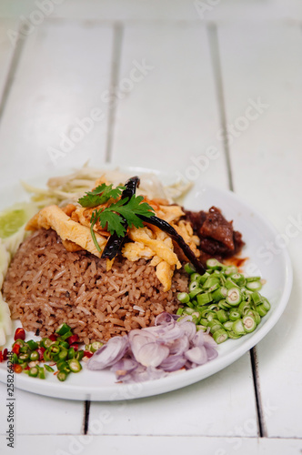 Thai shrimp paste fried rice with shallot, sweet barbeque pork, egg and vegetable