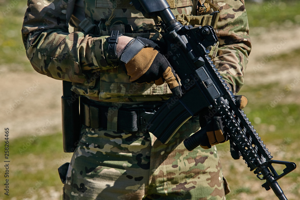 Armed soldier ready for battle. Military concept. Armed soldier ready for battle. Military concept.
