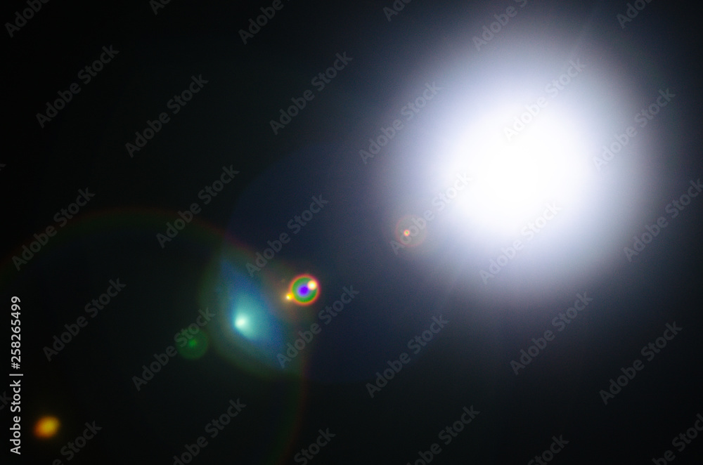 Abstract Natural Sun flare or Far star on the black background - obrazy, fototapety, plakaty 