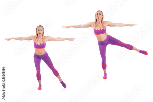 Beautiful young pregnant woman doing exercises on a white background. Early pregnancy.