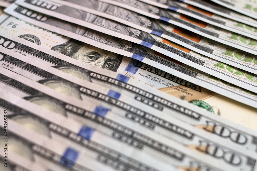 Dollars Closeup Concept. American Dollars Cash Money. One Hundred Dollar Banknotes - light version Dollars Closeup Concept. American Dollars Cash Money. One Hundred Dollar Banknotes - light version