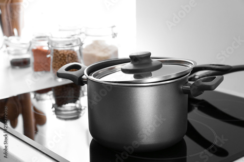 Saucepan on electric stove in kitchen