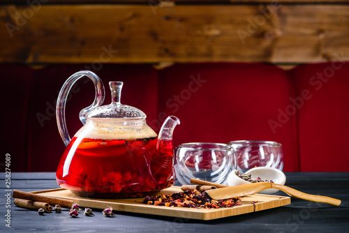 red tea in a glass teapot, tea ceremony