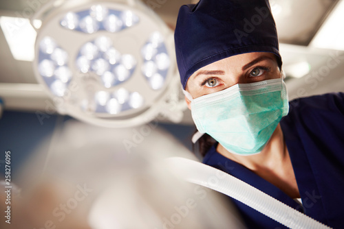 Portrait of female anesthesiologist in operating room photo