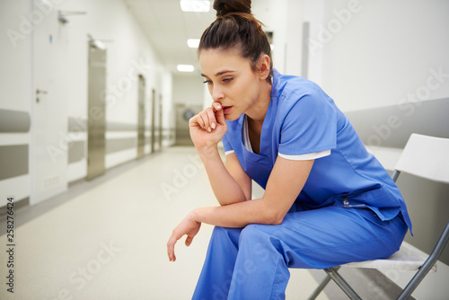 Bild auf Leinwand Stressed and worried doctor after long day at work