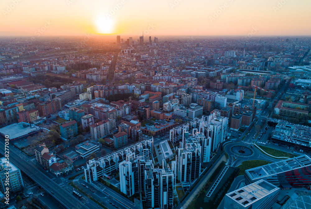 Milan panoramic skyline at sunrise, aerial view.