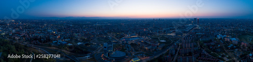 Milan panoramic skyline at dawn, aerial view.