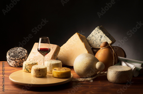 traditional italian cheeses on the wooden table