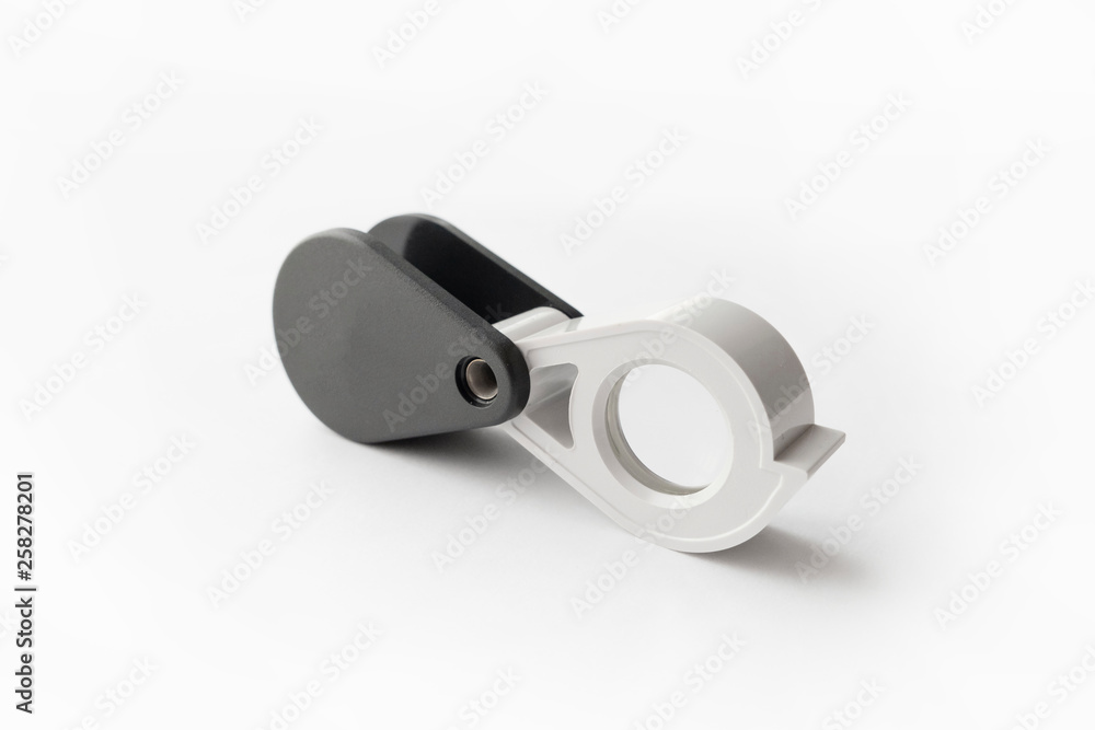 Magnifying glass for diamonds or see the amulet Isolated on a White Background. Magnifying glass for diamonds or see the amulet Isolated on a White Background.