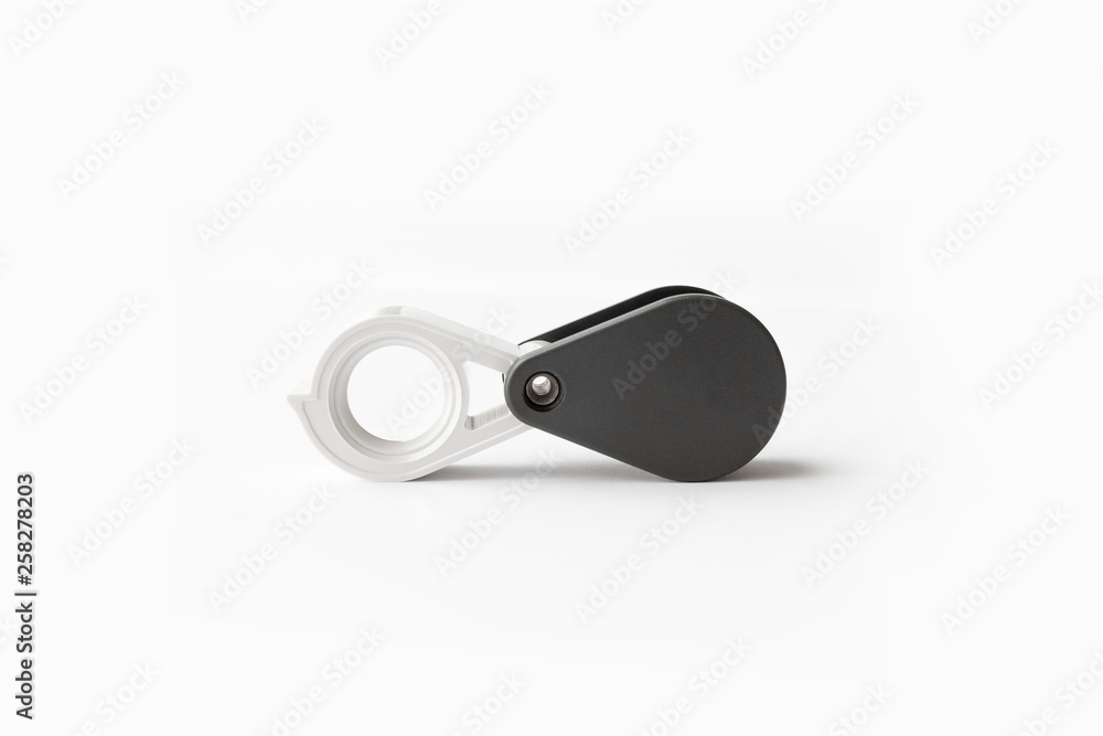 Magnifying glass for diamonds or see the amulet Isolated on a White Background. Magnifying glass for diamonds or see the amulet Isolated on a White Background.