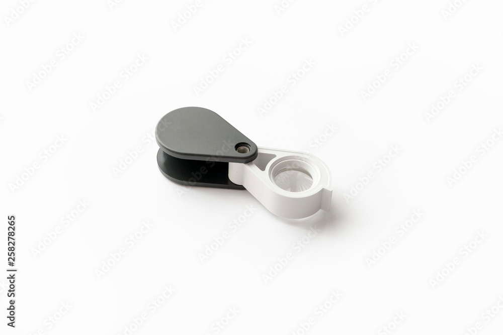 Magnifying glass for diamonds or see the amulet Isolated on a White Background. Magnifying glass for diamonds or see the amulet Isolated on a White Background.