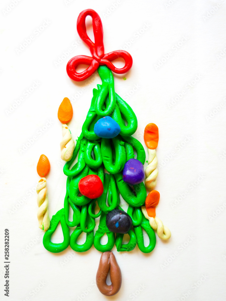 children's crafts Christmas tree with candles and balls of plasticine