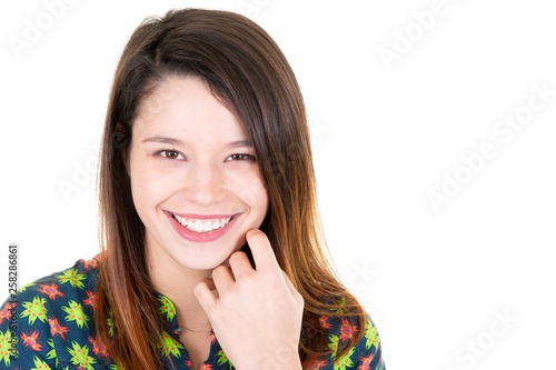 Close up studio shot of beautiful young woman smiling model with long hair looking at camera with charming cute