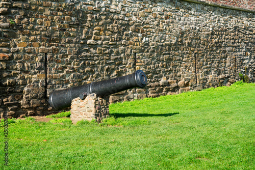 city wall  and cannon on grass field in fortified city Maastricht, The Netherlands