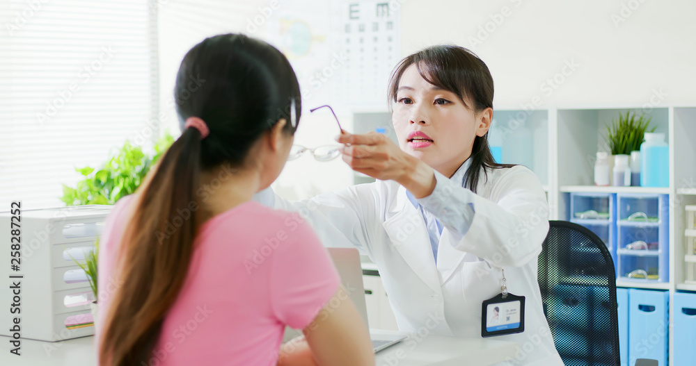 female ophthalmologist and patient female ophthalmologist and patient