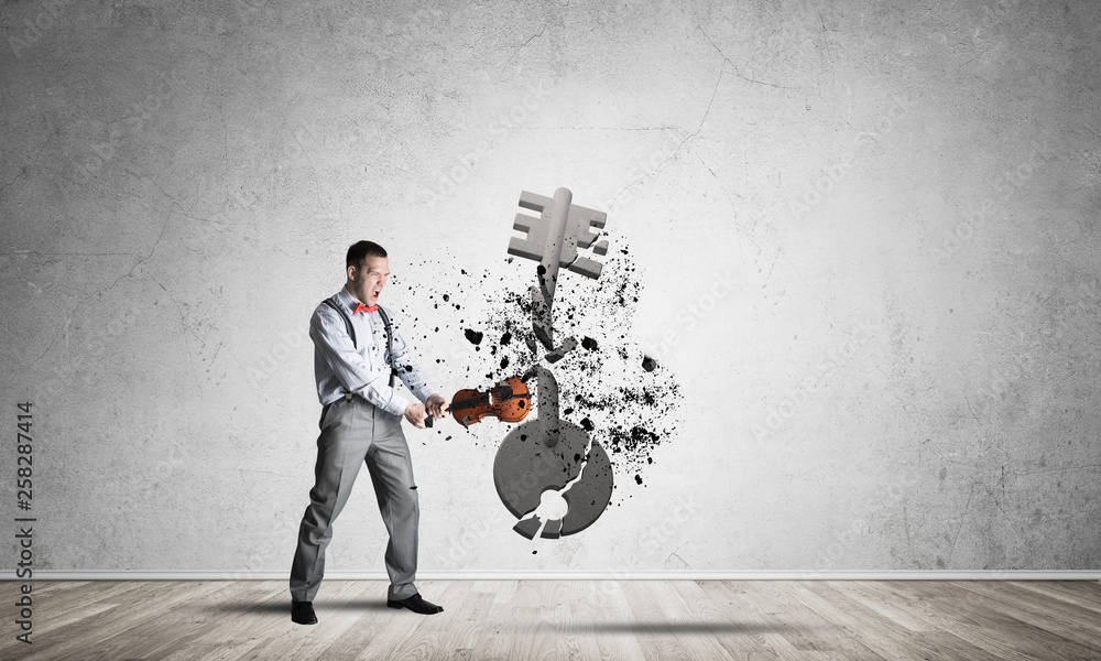 Breaking through access concept with man in room crashing concrete key Breaking through access concept with man in room crashing concrete key