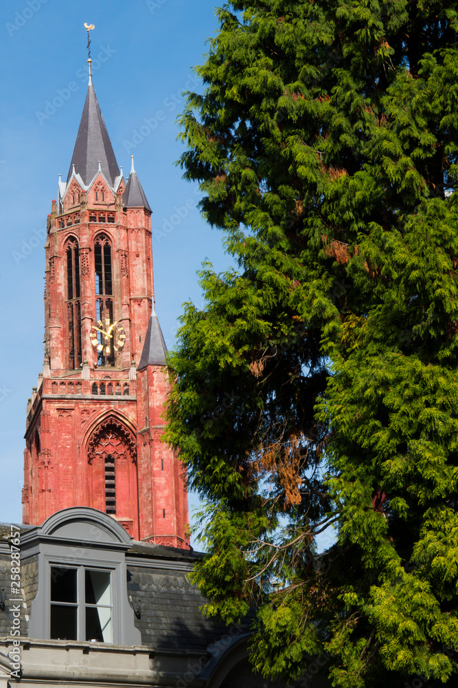 Fototapeta premium red orange tower of church, Sint Janskerk in Maastricht, The Netherlands