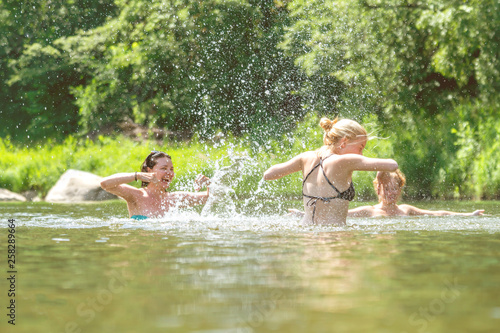 Women swimming and splashing in the water