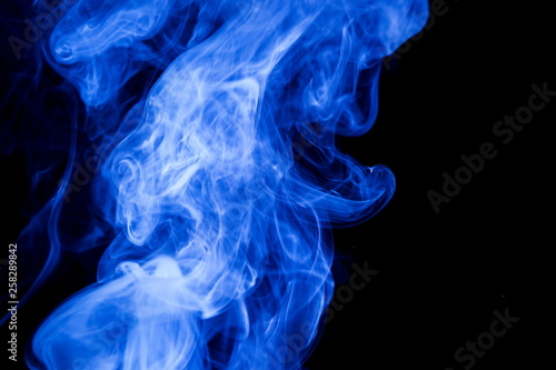 Blue smoke on black background