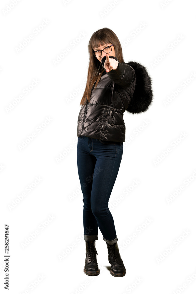 Full-length shot of Woman with glasses points finger at you with a confident expression Full-length shot of Woman with glasses points finger at you with a confident expression