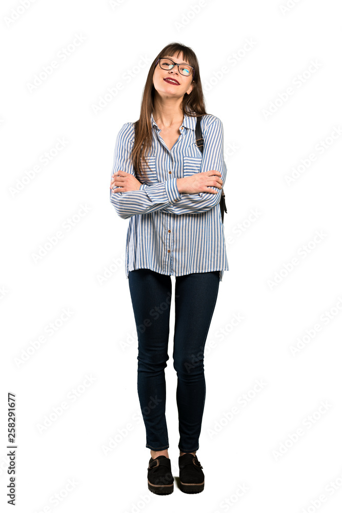 Full-length shot of Woman with glasses keeping the arms crossed in frontal position Full-length shot of Woman with glasses keeping the arms crossed in frontal position