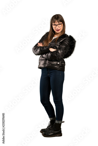 Full-length shot of Woman with glasses with arms crossed and looking forward