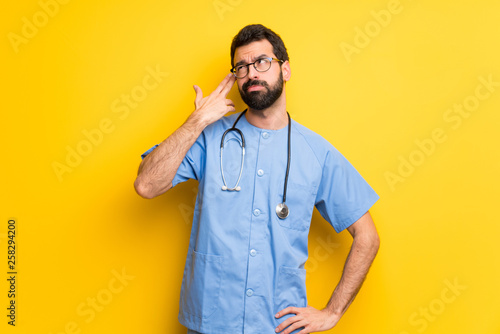 Surgeon doctor man with problems making suicide gesture © luismolinero