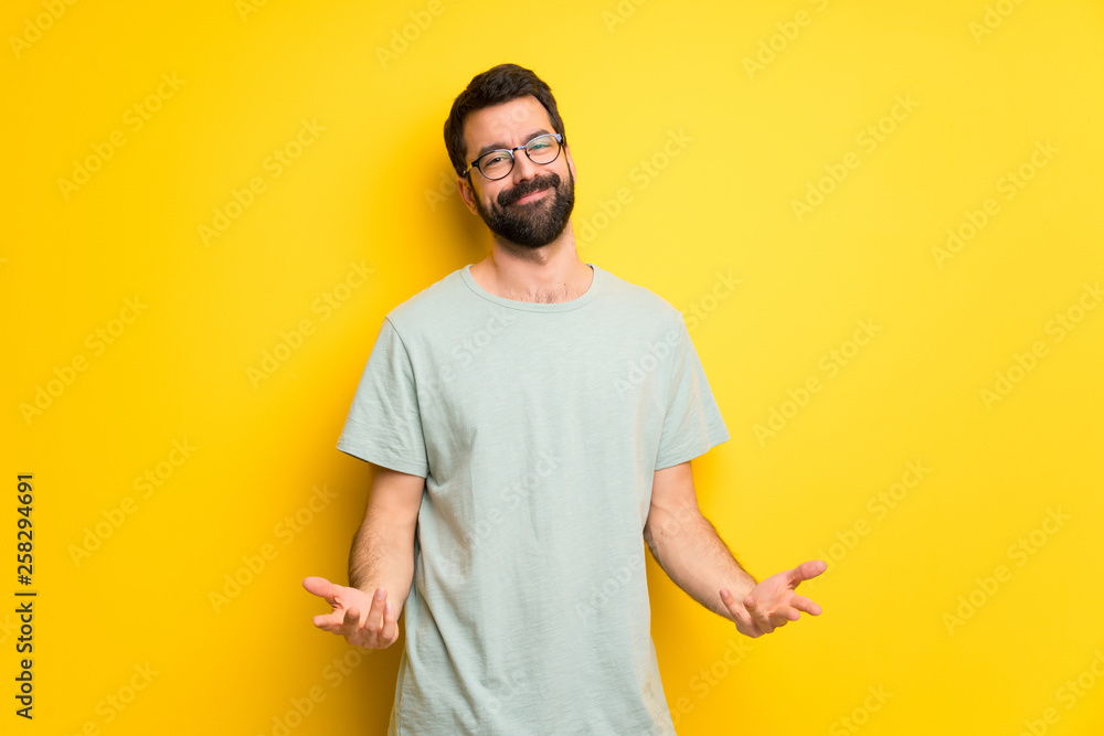 Man with beard and green shirt smiling Man with beard and green shirt smiling