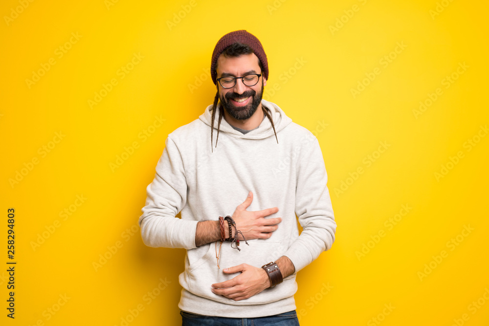 Hippie man with dreadlocks happy and smiling Hippie man with dreadlocks happy and smiling