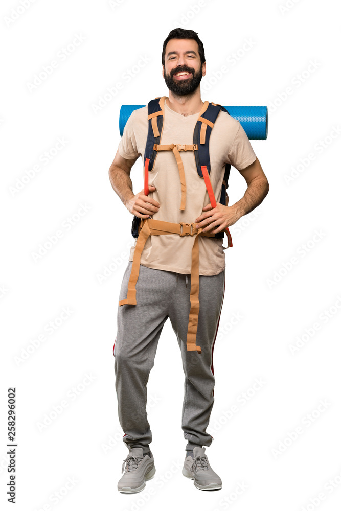Hiker man smiling over isolated white background Hiker man smiling over isolated white background