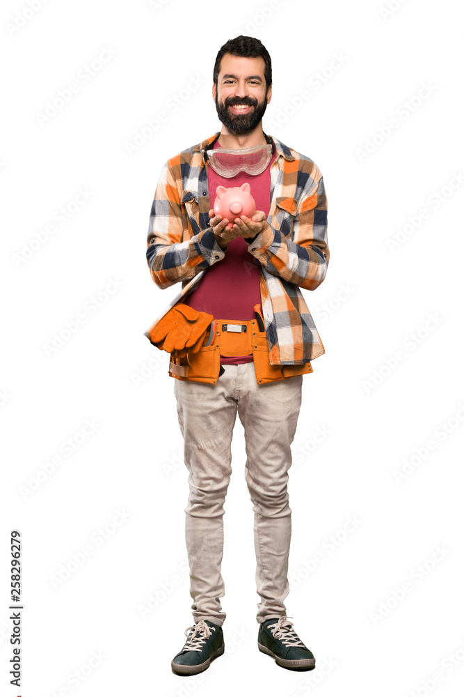 Craftsmen man holding a piggybank Craftsmen man holding a piggybank