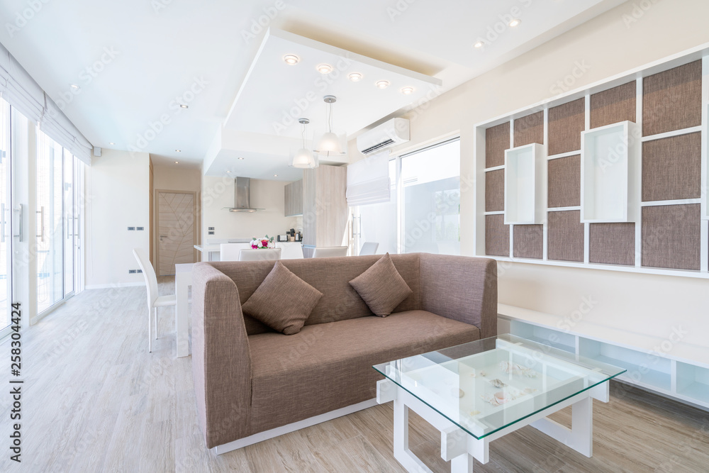 real estate , luxury interior design in living room of pool villas. Airy and bright space with high raised ceiling and dining table real estate , luxury interior design in living room of pool villas. Airy and bright space with high raised ceiling and dining table