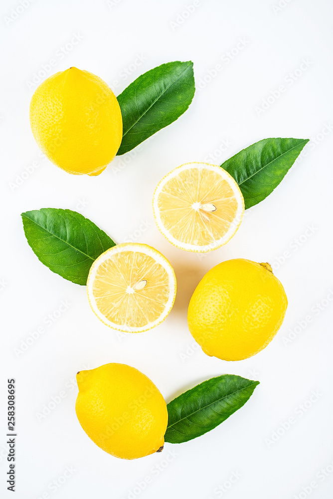 Naklejka Fresh yellow lemon on white background