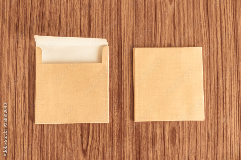 Set of two Brown envelope front and back isolated on wooden table hardwood floor background. Business cards blank. Mockup. Top high angel view object with clipping path. Flat Lay. Copy space for text Set of two Brown envelope front and back isolated on wooden table hardwood floor background. Business cards blank. Mockup. Top high angel view object with clipping path. Flat Lay. Copy space for text