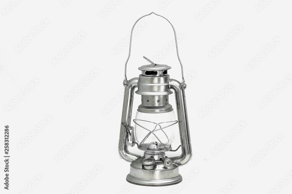 Old oil storm lamp on a white background. a vintage oil lamp