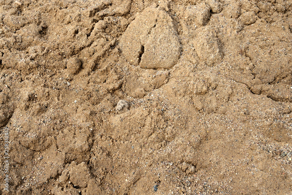 Large pile of construction sand close up as texture and background Large pile of construction sand close up as texture and background