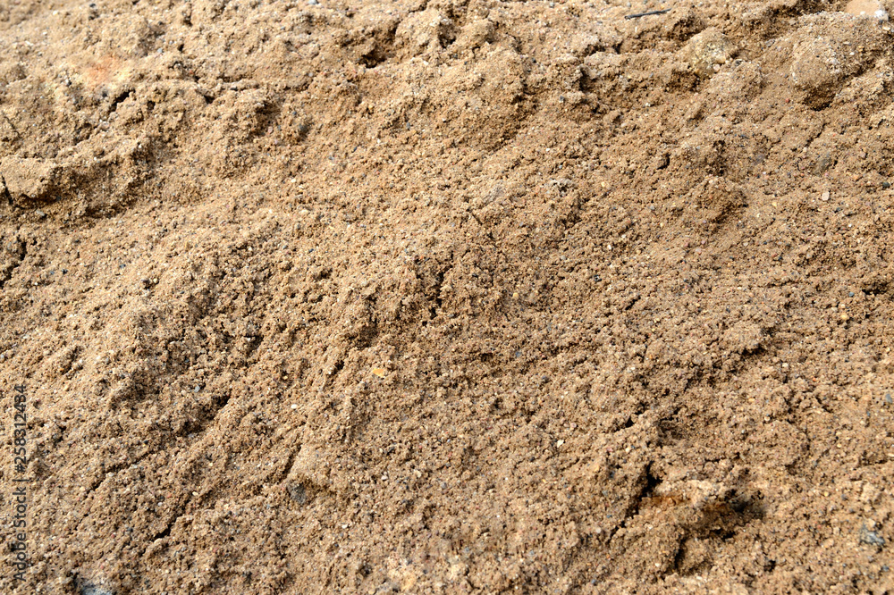 Large pile of construction sand close up as texture and background Large pile of construction sand close up as texture and background