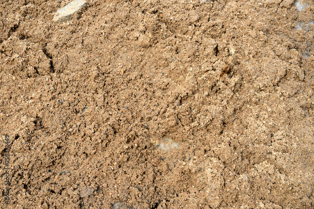 Large pile of construction sand close up as texture and background Large pile of construction sand close up as texture and background