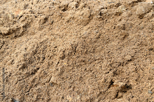 Large pile of construction sand close up as texture and background