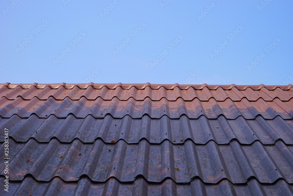 red tile roof and blue sky red tile roof and blue sky