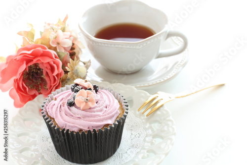 Blueberry cup cake and tea