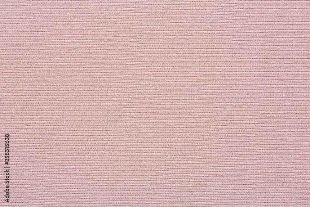 Fototapeta premium Pink cotton textile - close up of fabric texture. Cotton Fabric Texture. Top View of Cloth Textile Surface. Pink Clothing Background. Text Space. Abstract background and texture for designers.