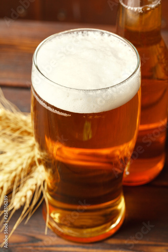 Glass beer on wood background