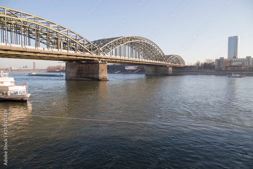 Naklejka premium The Hohenzollern Bridge (German: Hohenzollernbrücke) is a bridge crossing the river Rhine in the German city of Cologne on Dec 5, 2016 Germany