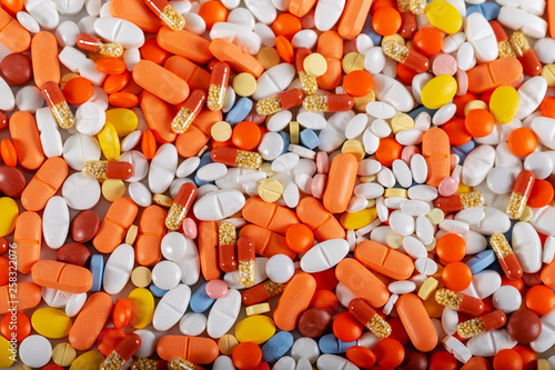 Colorful tablets and pills background